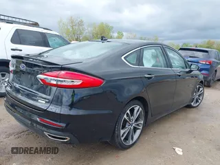 2019 Ford Fusion Titanium with VIN 3FA6P0K92KR248521, listed as a IAAI auction lot 42198307 with 51,844 mi miles and . Bid and sale history available at DreamBid. Image 4.