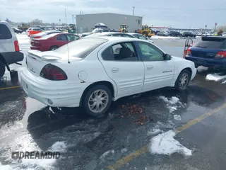 1999 Pontiac Grand Am SE1 with VIN 1G2NE52E3XM837376, listed as a IAAI auction lot 41552372 with 1 mi miles. Bid and sale history available at carsss.com. Image 4.