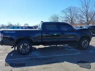 2021 Toyota Tacoma 4WD SR5 with VIN 3TMDZ5BN4MM117564, listed as a IAAI auction lot 41629220 with 77,063 mi miles. Bid and sale history available at carsss.com. Image 14.