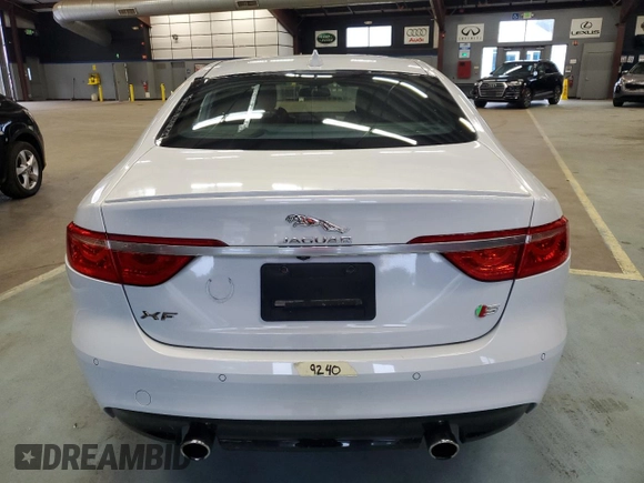 2016 Jaguar XF S with VIN SAJBG4BV0GCY00411, listed as a Copart auction lot 66068964 with 94,983 mi miles and Salvage Title. Bid and sale history available at carsss.com. Image 6.