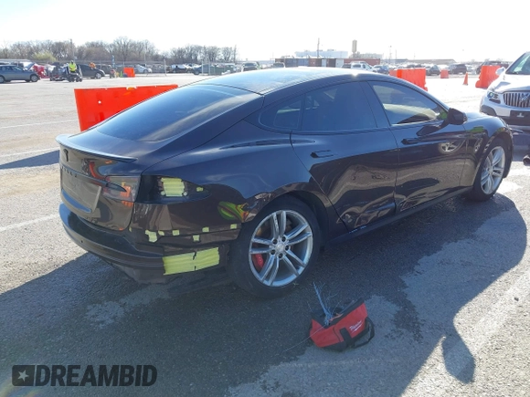 2014 Tesla Model S 60 with VIN 5YJSA1H17EFP33275, listed as a IAAI auction lot 41778167 with 202,749 mi miles and . Bid and sale history available at DreamBid. Image 4.