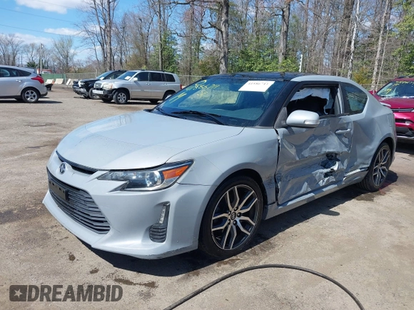 2014 Scion tC with VIN JTKJF5C70E3083839, listed as a IAAI auction lot 41886711 with 118,029 mi miles. Bid and sale history available at carsss.com. Image 6.