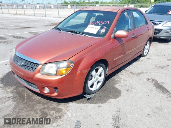 2009 Kia Spectra EX with VIN KNAFE221195026956, listed as a IAAI auction lot 42019309 with 121,341 mi miles. Bid and sale history available at carsss.com. Image 2.