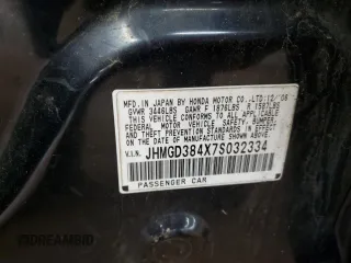 2007 Honda Fit with VIN JHMGD384X7S032334, listed as a Copart auction lot 52781425 with Not provided miles and Salvage title. Bid and sale history available at DreamBid. Image 13.