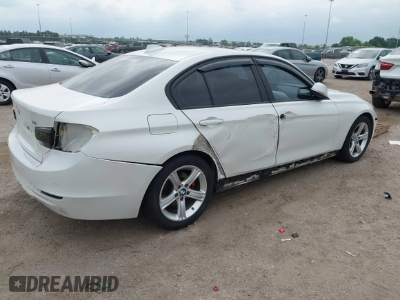 2012 BMW 3 Series 328i with VIN WBA3A5C51CF349987, listed as a IAAI auction lot 42013599 with 256,461 mi miles. Bid and sale history available at carsss.com. Image 4.