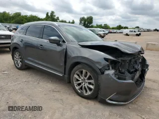 2016 Mazda CX-9 Grand Touring with VIN JM3TCADY3G0125814, listed as a Copart auction lot 58299595 with 127,035 mi miles and Salvage title. Bid and sale history available at DreamBid. Image 4.
