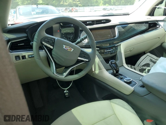 2022 Cadillac XT6 Premium Luxury with VIN 1GYKPCRS7NZ101706, listed as a Copart auction lot 63389985 with 27,021 mi miles and Salvage title. Bid and sale history available at DreamBid. Image 8.