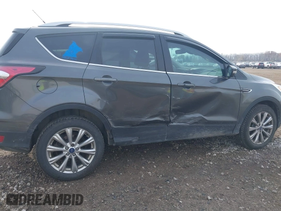 2017 Ford Escape Titanium with VIN 1FMCU9J98HUA49434, listed as a IAAI auction lot 40710866 with 143,850 mi miles. Bid and sale history available at carsss.com. Image 6.