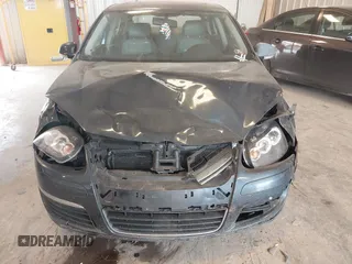 2006 Volkswagen Jetta 1.9L TDI z VIN 3VWDT71K26M624953, wystawiony jako IAAI lot #42420386 z przebiegiem 161 686 mil mil oraz . Historia ofert i sprzedaży dostępna na DreamBid. Obrazek 6.