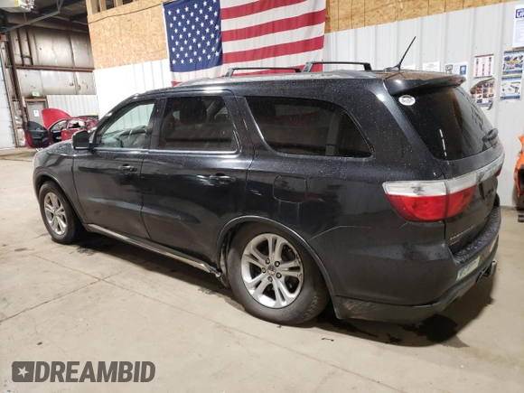 2012 Dodge Durango Crew with VIN 1C4SDJDT0CC323006, listed as a Copart auction lot 63631985 with 126,521 mi miles and Salvage title. Bid and sale history available at DreamBid. Image 2.