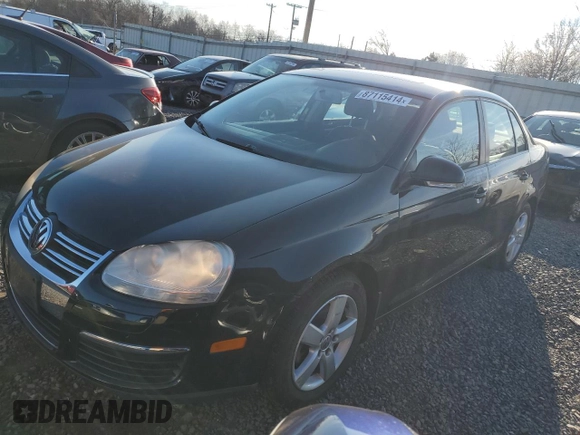 2009 Volkswagen Jetta z VIN 3VWHZ71K59M088780, wystawiony jako Copart lot #87115414 z przebiegiem 88 197 mil mil oraz Czysty tytuł • Clean title. Historia ofert i sprzedaży dostępna na DreamBid. Obrazek 1.