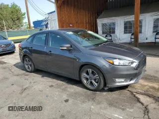 2016 Ford Focus SE z VIN 1FADP3FE7GL238752, wystawiony jako Copart lot #59226335 z przebiegiem 46 289 mil mil oraz Czysty tytuł • Clean title. Historia ofert i sprzedaży dostępna na DreamBid. Obrazek 4.