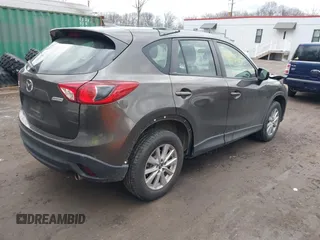 2016 Mazda CX-5 Sport with VIN JM3KE4BY8G0895209, listed as a IAAI auction lot 41688405 with 115,954 mi miles. Bid and sale history available at carsss.com. Image 4.
