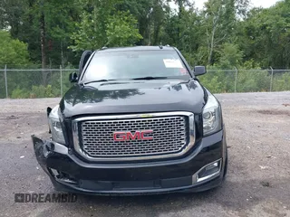 2016 GMC Yukon Denali with VIN 1GKS1CKJXGR254306, listed as a IAAI auction lot 39953539 with 164,149 mi miles. Bid and sale history available at carsss.com. Image 12.