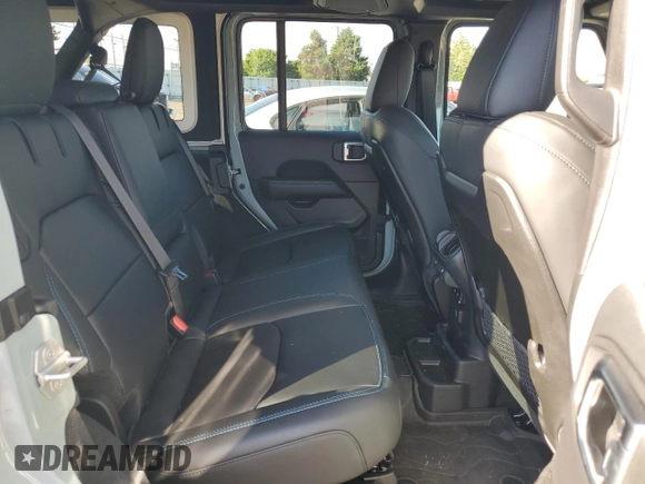 2024 Jeep Wrangler Rubicon z VIN 1C4RJXR64RW279791, wystawiony jako Copart lot #61348324 z przebiegiem 1 387 mil mil oraz Szkoda całkowita • Salvage title. Historia ofert i sprzedaży dostępna na DreamBid. Obrazek 10.