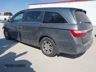 2012 Honda Odyssey EX-L with VIN 5FNRL5H69CB128585, listed as a IAAI auction lot 41695109 with 231,565 mi miles and . Bid and sale history available at carsss.com. Image 3.