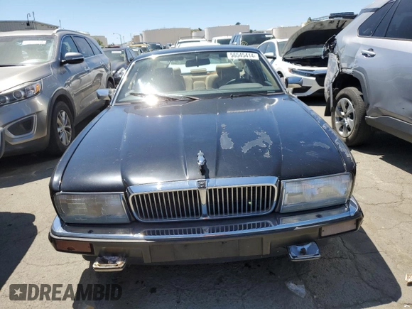 1990 Jaguar XJ with VIN SAJKY1745LC622713, listed as a Copart auction lot 56545414 with Not Provided miles and Salvage Title. Bid and sale history available at DreamBid. Image 5.