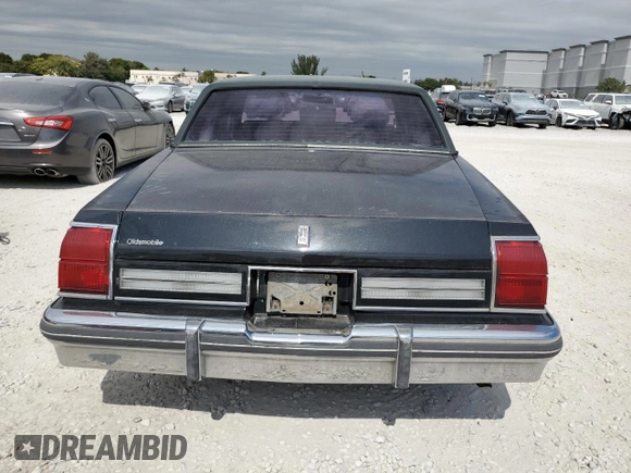 1985 Oldsmobile 88 z VIN 1G3BV69Y1FY384631, wystawiony jako Copart lot #43389795 z przebiegiem 180 641 mil mil oraz Szkoda całkowita • Salvage title. Historia ofert i sprzedaży dostępna na DreamBid. Obrazek 6.
