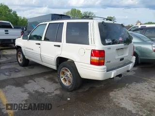 1998 Jeep Grand Cherokee Limited with VIN 1J4GZ78Y2WC164021, listed as a IAAI auction lot 42109012 with 1 mi miles. Bid and sale history available at carsss.com. Image 3.