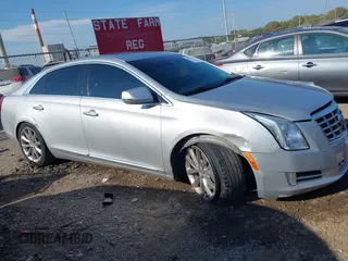 2013 Cadillac XTS Premium z VIN 2G61S5S30D9184910, wystawiony jako IAAI lot #40220419 z przebiegiem 111 330 mil mil oraz . Historia ofert i sprzedaży dostępna na DreamBid. Obrazek 13.