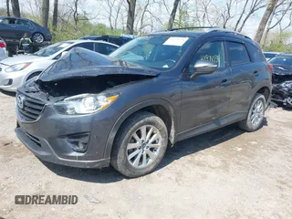 2016 Mazda CX-5 Touring with VIN JM3KE4CYXG0620990, listed as a IAAI auction lot 41978738 with 91,237 mi miles and . Bid and sale history available at carsss.com. Image 17.