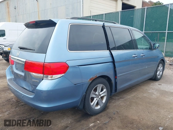 2010 Honda Odyssey Touring with VIN 5FNRL3H93AB008129, listed as a IAAI auction lot 42115112 with 260,075 mi miles. Bid and sale history available at carsss.com. Image 4.