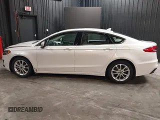 2020 Ford Fusion SE z VIN 3FA6P0LU8LR142370, wystawiony jako IAAI lot #42457342 z przebiegiem 53 808 mil mil oraz . Historia ofert i sprzedaży dostępna na DreamBid. Obrazek 14.