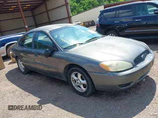 2005 Ford Taurus SE with VIN 1FAFP532X5A272398, listed as a IAAI auction lot 42001798 with 159,199 mi miles. Bid and sale history available at carsss.com. Image 1.