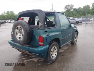 1996 Chevrolet Tracker z VIN 2CNBJ1860T6910906, wystawiony jako IAAI lot #42257309 z przebiegiem 206 888 mil mil oraz . Historia ofert i sprzedaży dostępna na DreamBid. Obrazek 6.