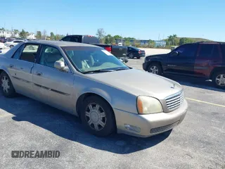 2004 Cadillac DeVille z VIN 1G6KD54Y44U121318, wystawiony jako IAAI lot #41833122 z przebiegiem 152 258 mil mil oraz . Historia ofert i sprzedaży dostępna na DreamBid. Obrazek 1.