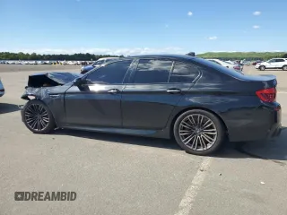 2014 BMW M5 z VIN WBSFV9C53ED594132, wystawiony jako Copart lot #67114384 z przebiegiem 89 020 mil mil oraz Szkoda całkowita • Salvage title. Historia ofert i sprzedaży dostępna na DreamBid. Obrazek 2.