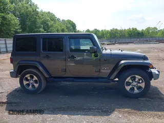 2016 Jeep Wrangler Unlimited Sahara with VIN 1C4BJWEG7GL340074, listed as a IAAI auction lot 42434763 with 81,095 mi miles and . Bid and sale history available at DreamBid. Image 13.