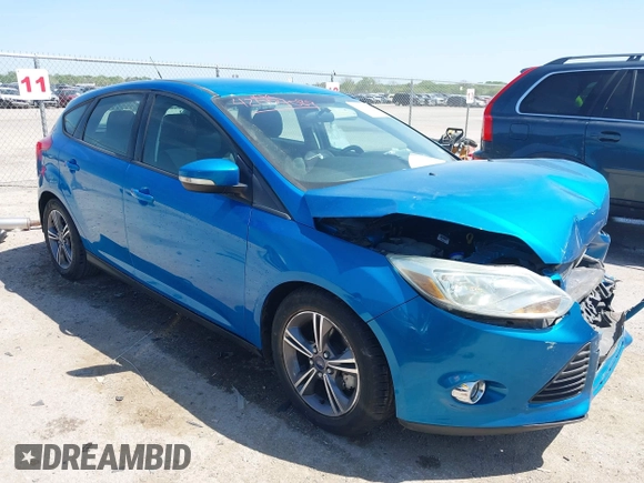 2014 Ford Focus SE with VIN 1FADP3K20EL383687, listed as a IAAI auction lot 42004089 with 127,374 mi miles. Bid and sale history available at carsss.com. Image 1.