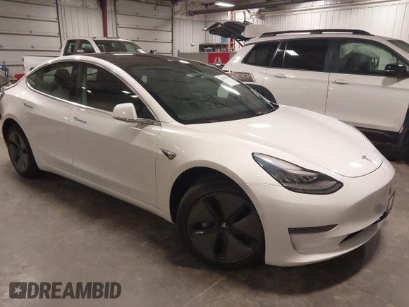 2019 Tesla Model 3 Mid Range z VIN 5YJ3E1EA5KF317542, wystawiony jako IAAI lot #42050461 z przebiegiem 55 054 mil mil oraz . Historia ofert i sprzedaży dostępna na DreamBid. Obrazek 1.