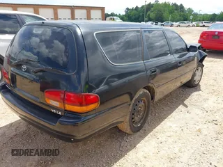 1996 Toyota Camry LE z VIN 4T1EF12K9TU117514, wystawiony jako IAAI lot #42241880 z przebiegiem 192 764 mil mil oraz . Historia ofert i sprzedaży dostępna na DreamBid. Obrazek 4.
