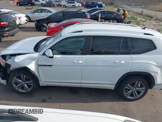 2018 Volkswagen Atlas SE z VIN 1V2FR2CA2JC540657, wystawiony jako IAAI lot #42115554 z przebiegiem 107 309 mil mil oraz . Historia ofert i sprzedaży dostępna na DreamBid. Obrazek 14.