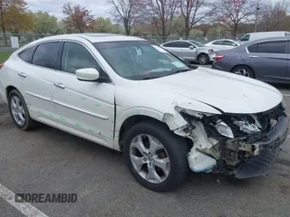 2010 Honda Crosstour EX-L z VIN 5J6TF2H57AL005231, wystawiony jako IAAI lot #42029109 z przebiegiem 134 451 mil mil oraz . Historia ofert i sprzedaży dostępna na DreamBid. Obrazek 1.