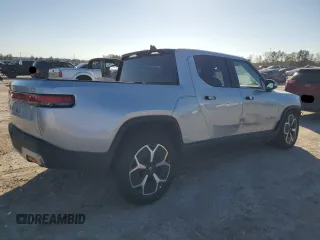 2023 Rivian R1T Adventure with VIN 7FCTGAAA3PN020577, listed as a Copart auction lot 84847414 with 7,888 mi miles and Salvage Title. Bid and sale history available at carsss.com. Image 3.