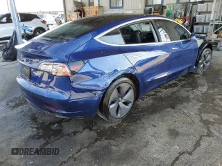 2020 Tesla Model 3 Standard Range Plus with VIN 5YJ3E1EA7LF705907, listed as a Copart auction lot 48765145 with 104,479 mi miles and Salvage Title. Bid and sale history available at DreamBid. Image 3.