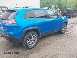 2021 Jeep Cherokee Trailhawk with VIN 1C4PJMBXXMD173102, listed as a IAAI auction lot 42205402 with 57,321 mi miles and . Bid and sale history available at DreamBid. Image 4.