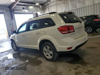2012 Dodge Journey SXT with VIN 3C4PDCBG0CT174320, listed as a Copart auction lot 65138585 with 156,475 mi miles and Clean title. Bid and sale history available at DreamBid. Image 2.