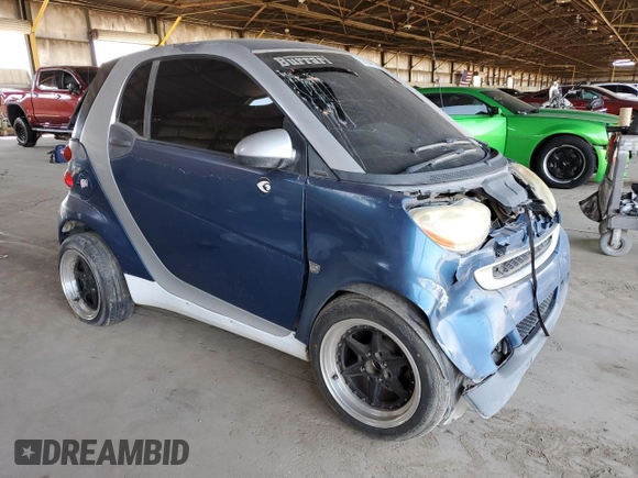 2010 Smart fortwo Pure с VIN WMEEJ3BA1AK360041, выставлен на аукционе Copart как лот 59594055 с пробегом Не указан миль и Списание • Salvage title. История ставок и продаж доступна на DreamBid. Изображение 4.