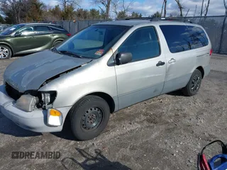 2002 Toyota Sienna LE with VIN 4T3ZF13C52U450825, listed as a IAAI auction lot 41604636 with 179,495 mi miles. Bid and sale history available at carsss.com. Image 2.