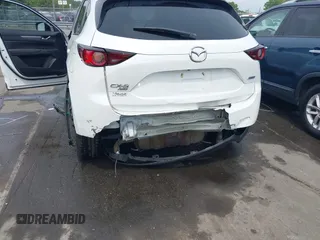 2018 Mazda CX-5 Touring with VIN JM3KFBCMXJ0366008, listed as a IAAI auction lot 42079989 with 153,868 mi miles and . Bid and sale history available at DreamBid. Image 6.