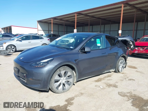 2023 Tesla Model Y Long Range with VIN 7SAYGAEE8PF667728, listed as a IAAI auction lot 41839771 with 32,654 mi miles and . Bid and sale history available at DreamBid. Image 2.