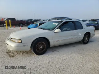 1997 Mercury Cougar z VIN 1MELM62W0VH602622, wystawiony jako Copart lot #77042354 z przebiegiem 122 027 mil mil oraz Nie do naprawy. Historia ofert i sprzedaży dostępna na DreamBid. Obrazek 1.