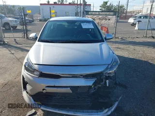 2023 Kia Rio LX with VIN 3KPA24AD1PE599290, listed as a IAAI auction lot 41023283 with 10,027 mi miles and . Bid and sale history available at DreamBid. Image 12.