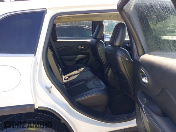 2021 Jeep Cherokee Altitude with VIN 1C4PJLLBXMD164087, listed as a IAAI auction lot 41694113 with 76,352 mi miles. Bid and sale history available at carsss.com. Image 8.
