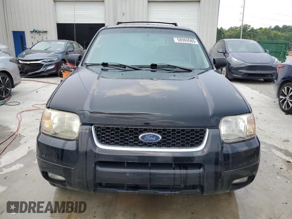 2004 Ford Escape Limited with VIN 1FMCU04164KB51256, listed as a Copart auction lot 58969565 with 137,360 mi miles and Salvage title. Bid and sale history available at DreamBid. Image 5.