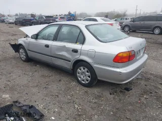1999 Honda Civic LX with VIN 2HGEJ6675XH504044, listed as a IAAI auction lot 41949437 with 208,534 mi miles. Bid and sale history available at carsss.com. Image 3.